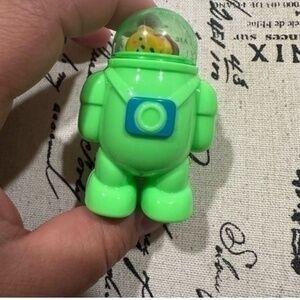 Green astronaut shaped pencil sharpener